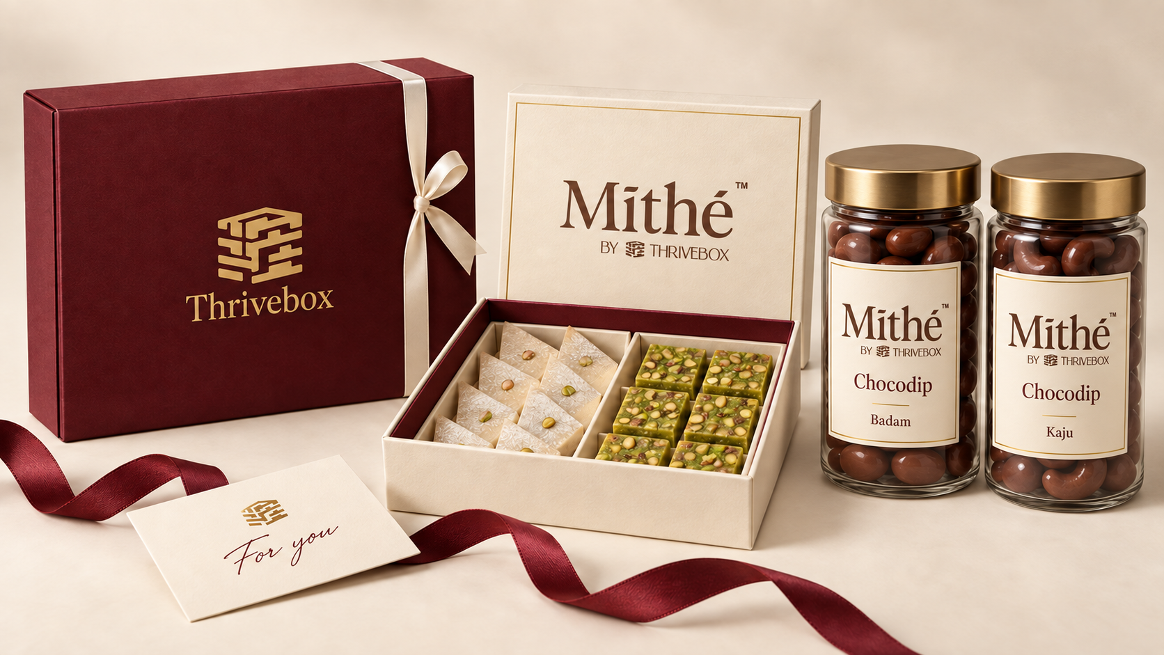 Mithé by Thrivebox sweets box and Chocodip jars beside a Thrivebox hamper and gift note